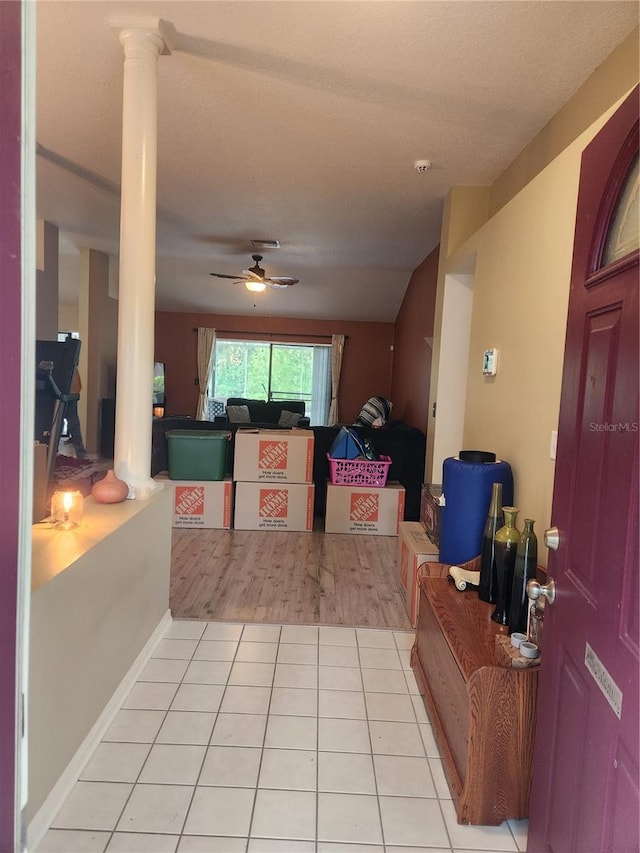 9220 Dayflower Dr, Tampa, FL 33647 - entryway with decorative columns, a ceiling fan, and light tile patterned flooring