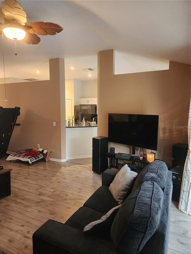9220 Dayflower Dr, Tampa, FL 33647 - living area featuring light wood finished floors and a ceiling fan