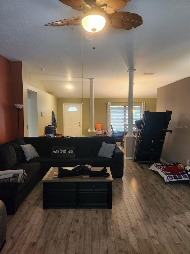 9220 Dayflower Dr, Tampa, FL 33647 - living area with decorative columns, wood finished floors, and ceiling fan