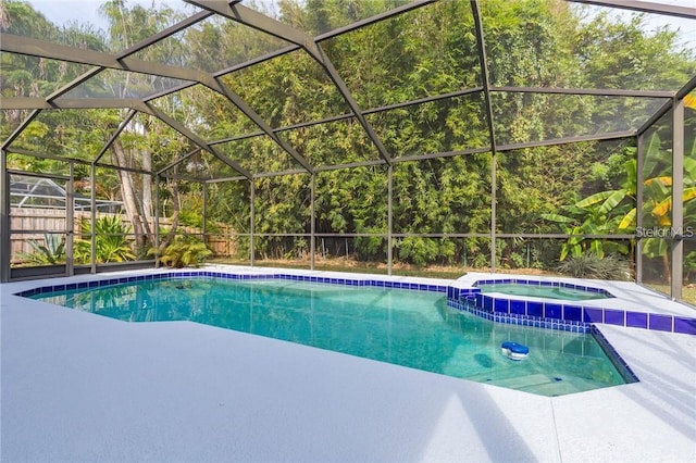 9220 Dayflower Dr, Tampa, FL 33647 - view of pool with a pool with connected hot tub, a lanai, and a patio