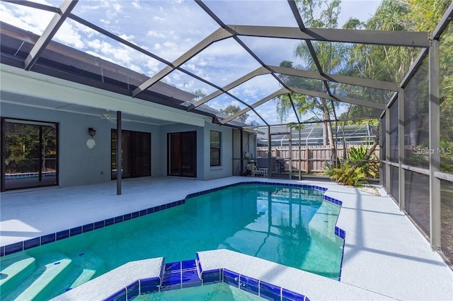 9220 Dayflower Dr, Tampa, FL 33647 - view of pool featuring a patio, a pool with connected hot tub, ceiling fan, and a lanai