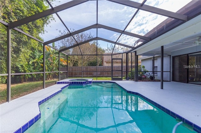 9220 Dayflower Dr, Tampa, FL 33647 - view of pool featuring a patio, glass enclosure, a pool with connected hot tub, and fence
