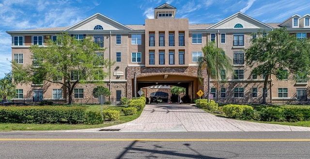 4221 W Spruce St Unit 1303, Tampa, FL 33607 - view of property featuring driveway and an attached garage