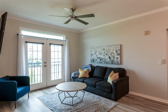 4221 W Spruce St Unit 1303, Tampa, FL 33607 - living room with french doors, a ceiling fan, wood finished floors, plenty of natural light, and crown molding