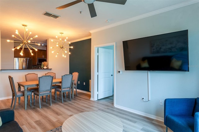 4221 W Spruce St Unit 1303, Tampa, FL 33607 - living area featuring a chandelier, ornamental molding, baseboards, wood finished floors, and ceiling fan