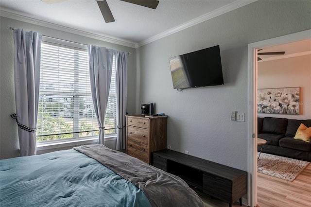 4221 W Spruce St Unit 1303, Tampa, FL 33607 - bedroom with crown molding, multiple windows, wood finished floors, and a ceiling fan