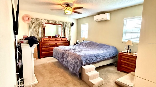 7012 Pin Cherry Ln, Port Richey, FL 34668 - carpeted bedroom featuring a wall mounted AC, a textured ceiling, and a ceiling fan