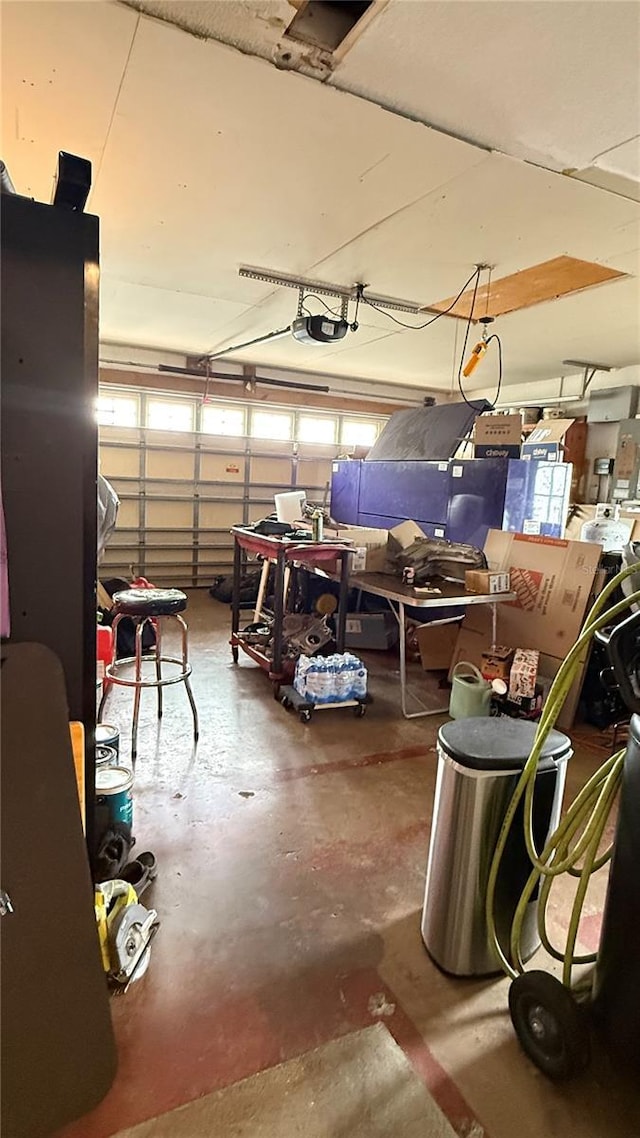 7012 Pin Cherry Ln, Port Richey, FL 34668 - garage featuring a garage door opener