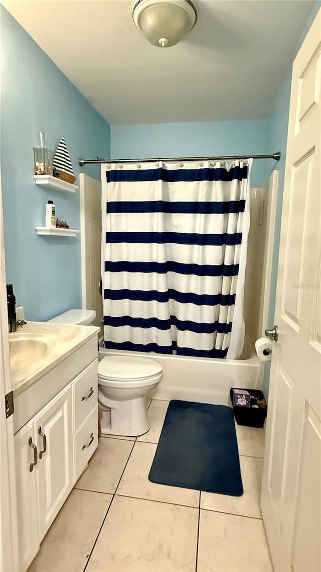 7012 Pin Cherry Ln, Port Richey, FL 34668 - bathroom with shower / bathtub combination with curtain, tile patterned floors, vanity, and toilet