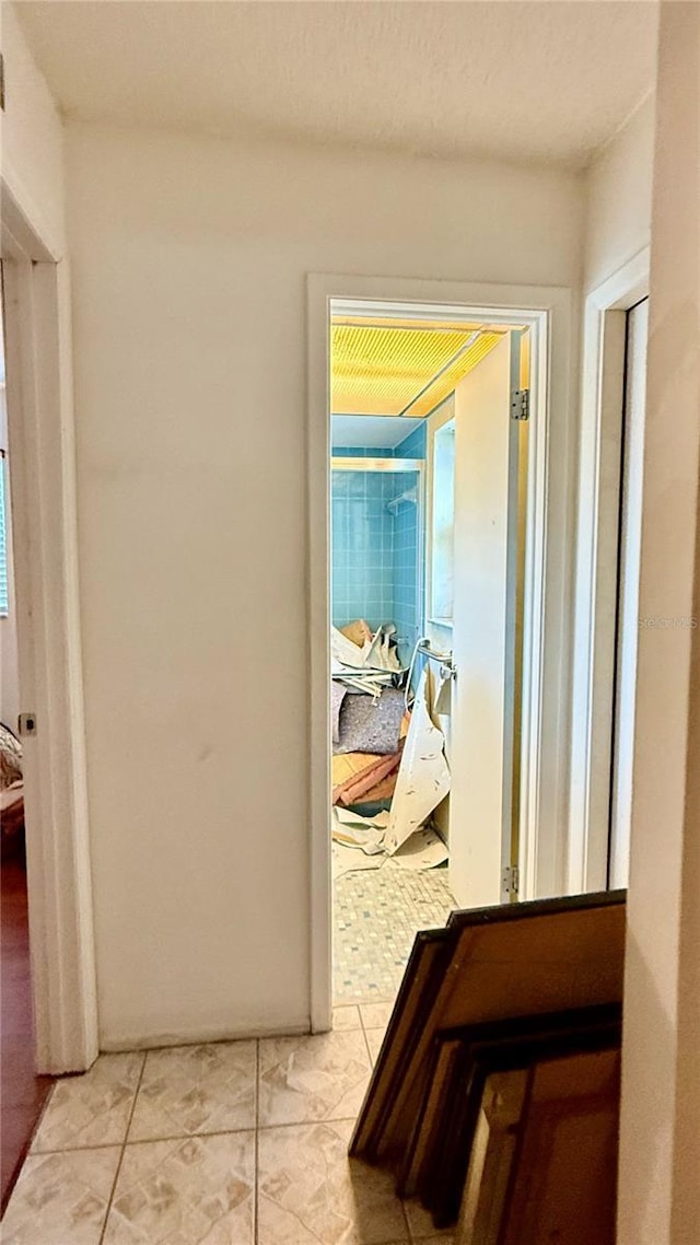 7012 Pin Cherry Ln, Port Richey, FL 34668 - hallway with light tile patterned flooring