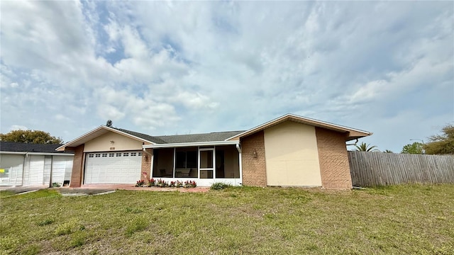 7012 Pin Cherry Ln, Port Richey, FL 34668 - view of front of property featuring an attached garage and a sunroom