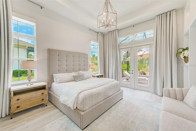 16707 Verona Pl, Bradenton, FL 34202 - bedroom with multiple windows, a chandelier, access to outside, and french doors