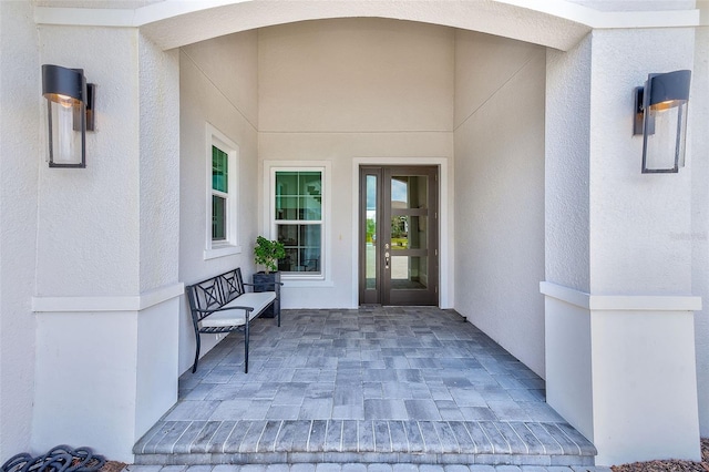 16707 Verona Pl, Bradenton, FL 34202 - doorway to property with stucco siding and a patio