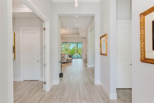 16707 Verona Pl, Bradenton, FL 34202 - hallway with light wood-style flooring, recessed lighting, and a tray ceiling