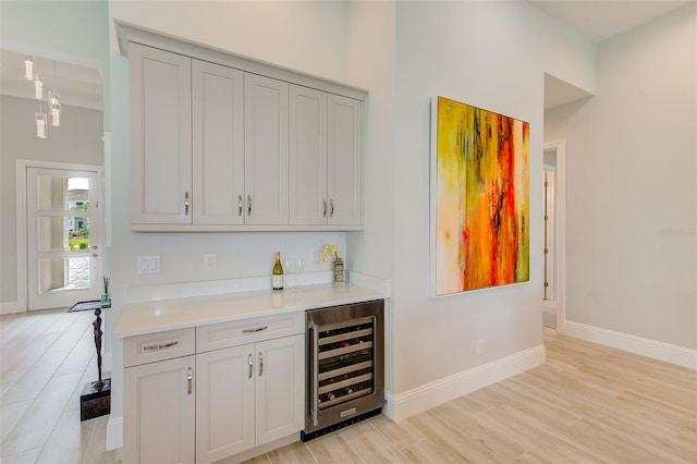 16707 Verona Pl, Bradenton, FL 34202 - indoor dry bar with wine cooler and light wood-type flooring