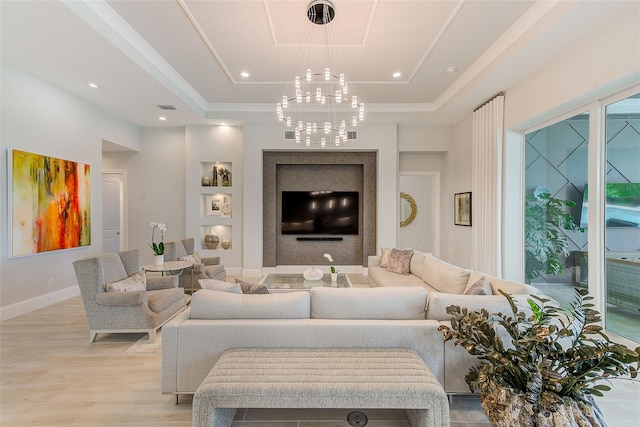 16707 Verona Pl, Bradenton, FL 34202 - living area featuring a chandelier, a raised ceiling, light wood finished floors, and recessed lighting