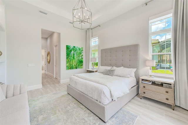 16707 Verona Pl, Bradenton, FL 34202 - bedroom with a chandelier and light wood finished floors