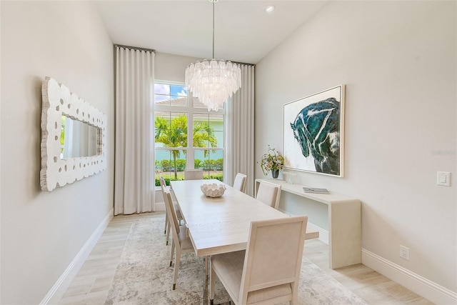 16707 Verona Pl, Bradenton, FL 34202 - dining room featuring a chandelier and light wood-style flooring