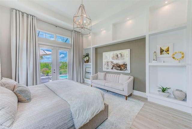 16707 Verona Pl, Bradenton, FL 34202 - bedroom with access to outside, a towering ceiling, a chandelier, french doors, and wood finished floors