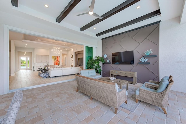 16707 Verona Pl, Bradenton, FL 34202 - living area featuring a tray ceiling, a ceiling fan, beamed ceiling, and recessed lighting