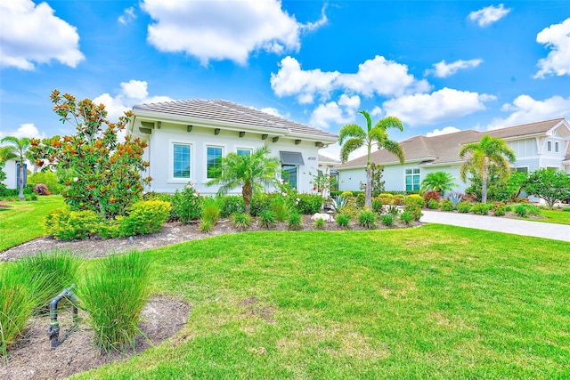 16707 Verona Pl, Bradenton, FL 34202 - view of front of house featuring a front yard and a tiled roof