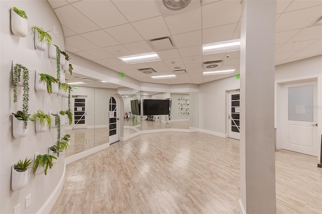 16707 Verona Pl, Bradenton, FL 34202 - workout area with wood finished floors, a drop ceiling, and arched walkways