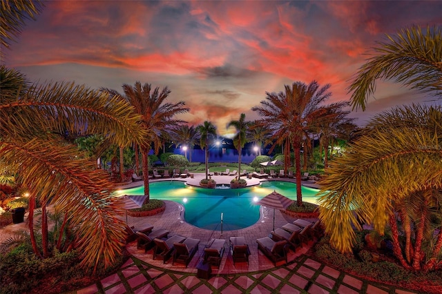 16707 Verona Pl, Bradenton, FL 34202 - pool at dusk featuring a patio and an outdoor pool