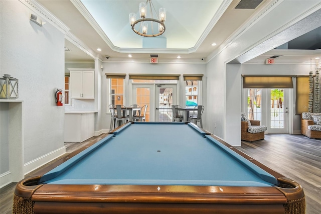rec room featuring pool table, french doors, wood finished floors, crown molding, and a tray ceiling