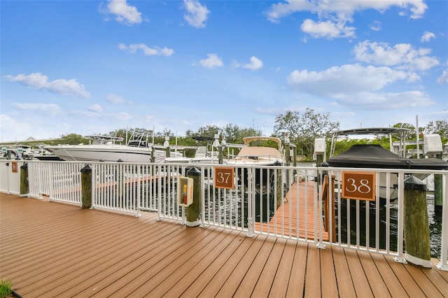 deck featuring boat lift and a boat dock