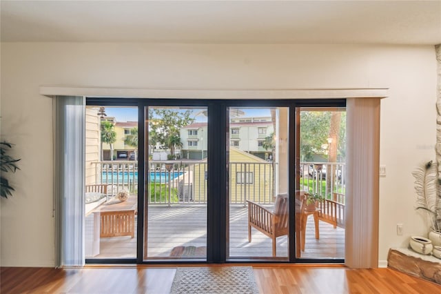 531 Sandy Hook Rd, Treasure Island, FL 33706 - doorway to outside featuring wood finished floors
