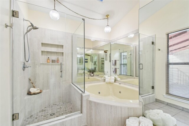 531 Sandy Hook Rd, Treasure Island, FL 33706 - full bath featuring a shower stall, a tub with jets, and tile patterned floors