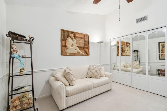 531 Sandy Hook Rd, Treasure Island, FL 33706 - carpeted living room featuring a ceiling fan