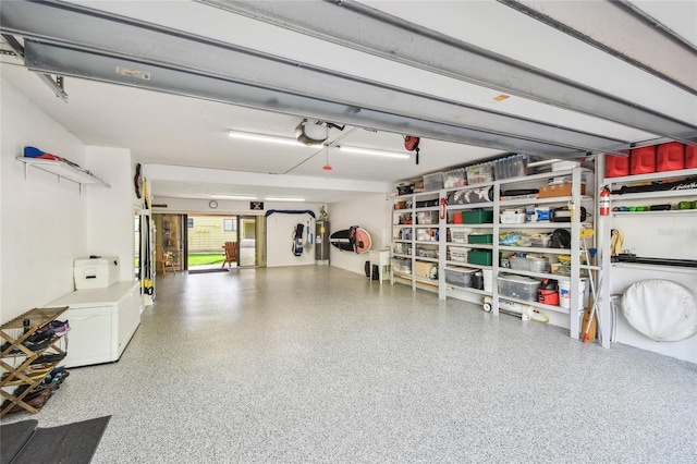 531 Sandy Hook Rd, Treasure Island, FL 33706 - garage with water heater and a garage door opener