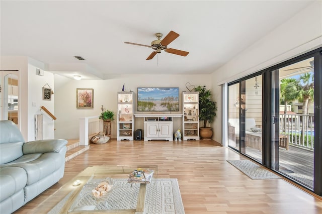 531 Sandy Hook Rd, Treasure Island, FL 33706 - living room featuring a ceiling fan and light wood-type flooring