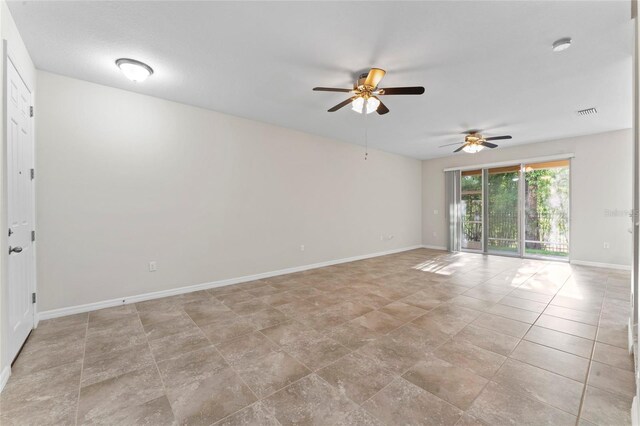 13233 Canopy Creek Dr, Tampa, FL 33625 - empty room featuring ceiling fan and baseboards