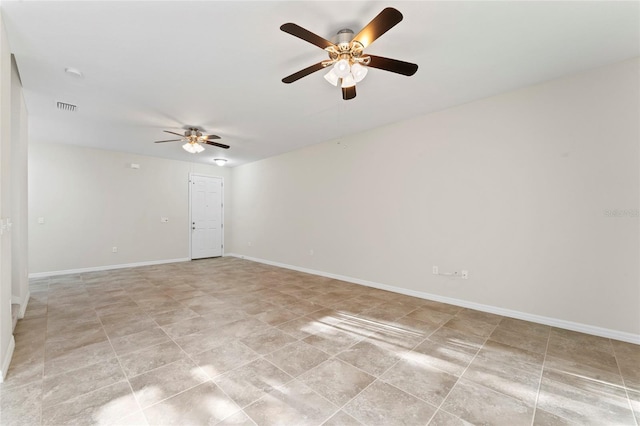 13233 Canopy Creek Dr, Tampa, FL 33625 - spare room featuring a ceiling fan and baseboards