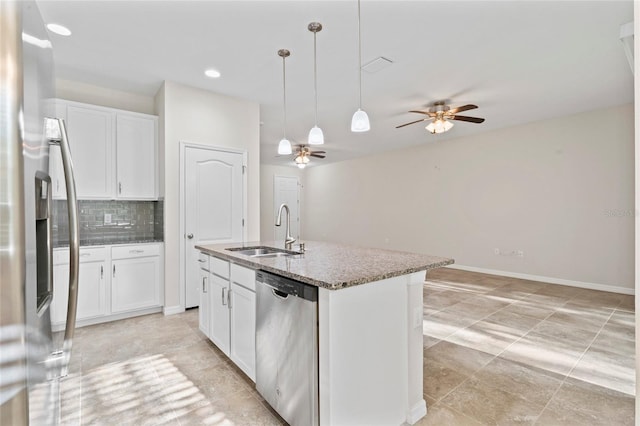 13233 Canopy Creek Dr, Tampa, FL 33625 - kitchen with stainless steel appliances, a sink, white cabinetry, backsplash, and recessed lighting