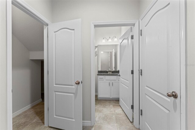 13233 Canopy Creek Dr, Tampa, FL 33625 - bathroom with baseboards and vanity