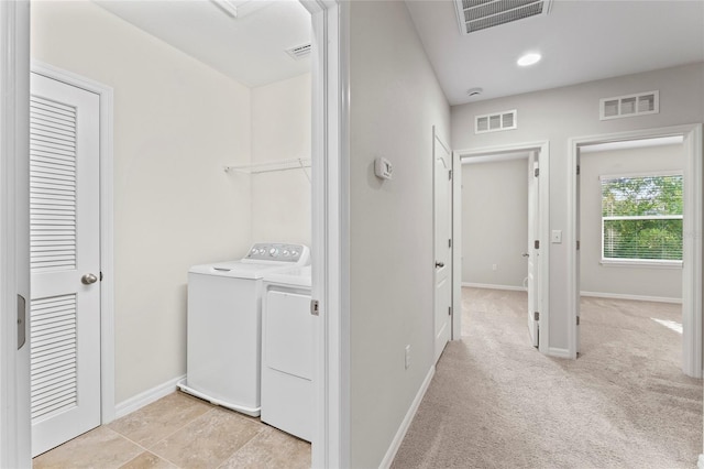 13233 Canopy Creek Dr, Tampa, FL 33625 - laundry room with washer and clothes dryer, baseboards, light colored carpet, and recessed lighting