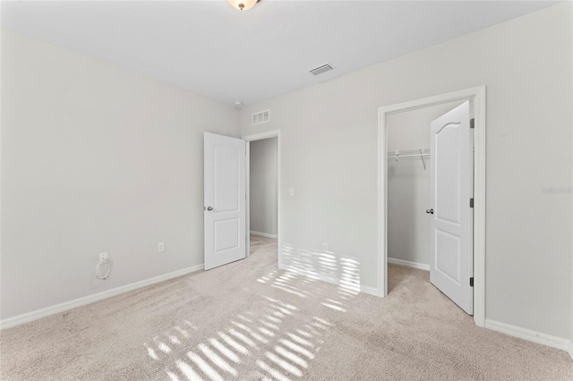 13233 Canopy Creek Dr, Tampa, FL 33625 - unfurnished bedroom with carpet floors, a walk in closet, baseboards, and a closet