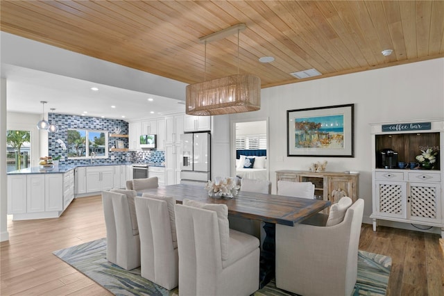 243 Hermosita Dr, St Pete Beach, FL 33706 - dining space with light wood-type flooring, recessed lighting, and wood ceiling