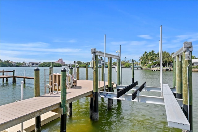 243 Hermosita Dr, St Pete Beach, FL 33706 - dock featuring boat lift and a water view
