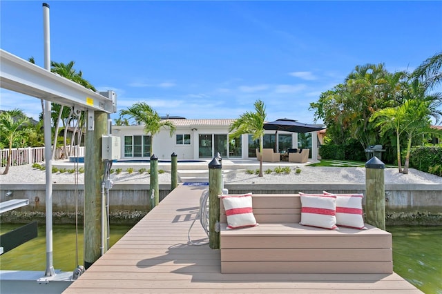 243 Hermosita Dr, St Pete Beach, FL 33706 - dock with an outdoor living space, a gazebo, a patio, and a water view