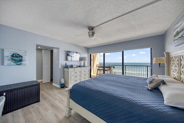 15000 Gulf Blvd Unit 602, Madeira Beach, FL 33708 - bedroom featuring access to outside, light wood-style floors, ceiling fan, and baseboards