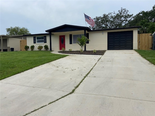 ranch-style home featuring an attached garage and driveway