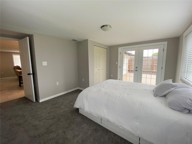 bedroom with french doors, access to exterior, dark carpet, baseboards, and a closet