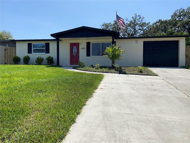 12907 College Hill Dr, Hudson, FL 34667 - single story home featuring a garage and driveway