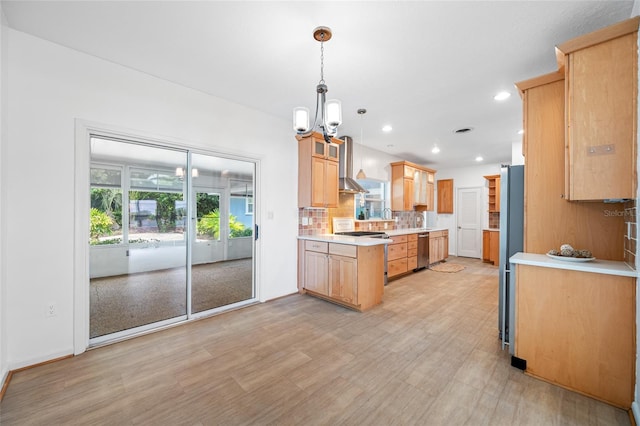 401 Whitcomb Blvd, Tarpon Springs, FL 34689 - kitchen with stainless steel appliances, light countertops, backsplash, light wood-style floors, and a chandelier