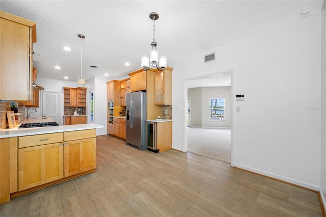 401 Whitcomb Blvd, Tarpon Springs, FL 34689 - kitchen with stainless steel refrigerator with ice dispenser, beverage cooler, a peninsula, a sink, and light countertops