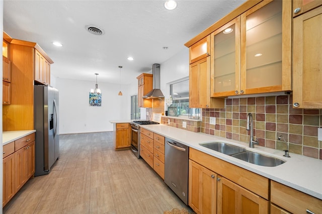 401 Whitcomb Blvd, Tarpon Springs, FL 34689 - kitchen featuring appliances with stainless steel finishes, wall chimney range hood, a sink, light countertops, and recessed lighting
